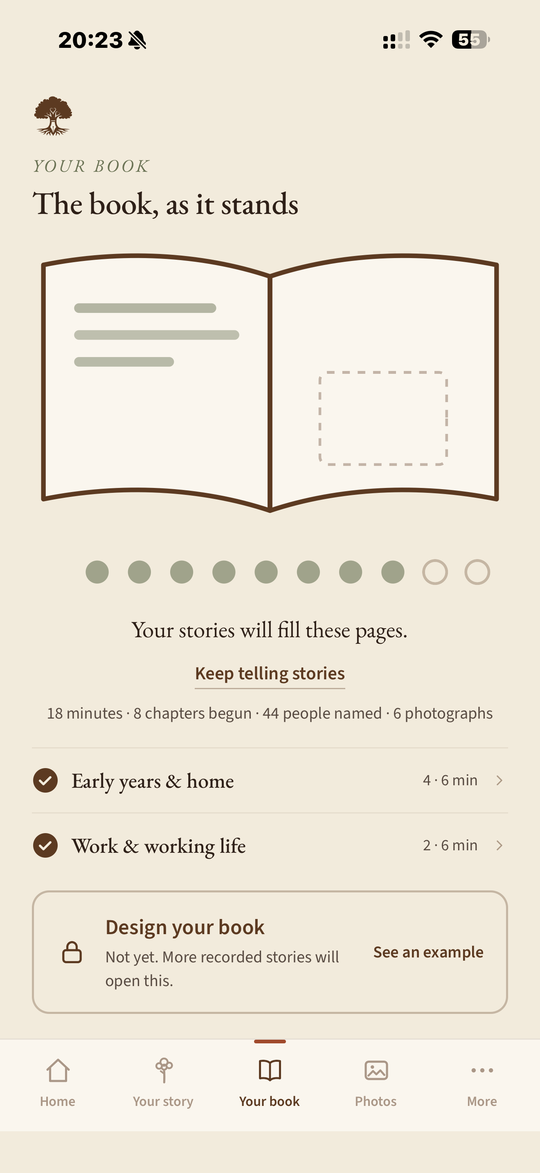The Penmora Your book screen, headed The book, as it stands: a drawing of an open book, a row of dots showing how much has been recorded so far, a line reading eighteen minutes, eight chapters begun, forty-four people named and six photographs, and a Design your book step still locked until more stories are recorded.